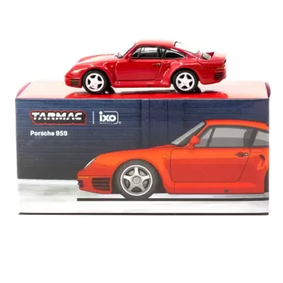 Miniatura de Porsche 959 vermelho sobre caixa com texto e imagem do carro