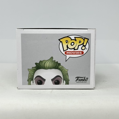 Caixa de Funko Pop com personagem com cabelo verde e balão POP! MOVIES