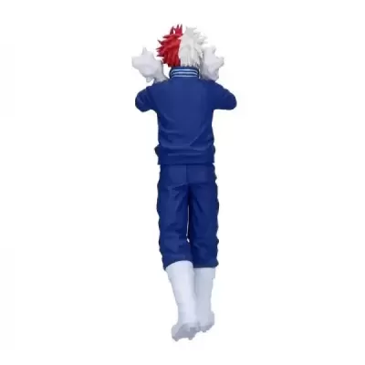 Figura colecionável de personagem com fato de treino azul e botas brancas, cabelo vermelho e branco