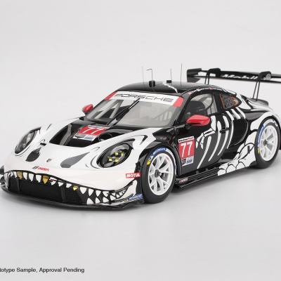 Miniatura de carro de corrida Porsche com pintura preta e branca e detalhes em vermelho