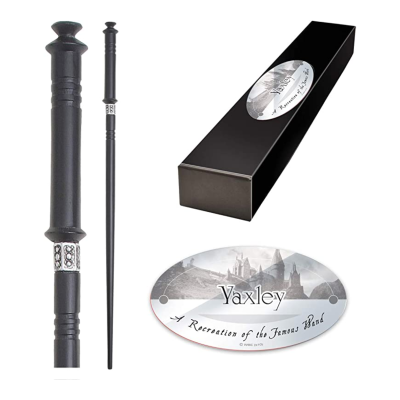 Varinha preta com detalhes prateados, caixa preta e selo oval com texto e imagem de castelo