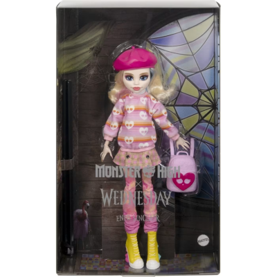 Boneca Monster High Wednesday com roupa rosa e botas amarelas em caixa