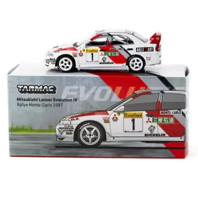 Miniatura do Mitsubishi Lancer Evolution IV Rallye Monte-Carlo 1997 branca com detalhes vermelhos e pretos sobre caixa ilustrada