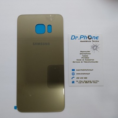 Capa traseira dourada para smartphone Samsung ao lado de cartão de visitas Dr. Phone