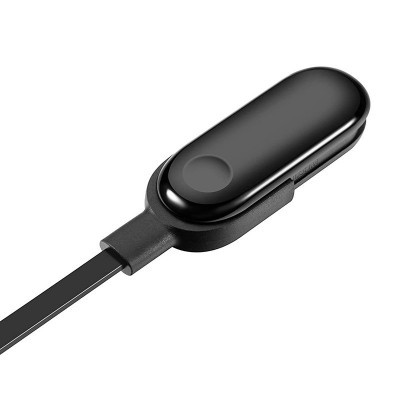 Dispositivo preto com botão circular e cabo USB preto