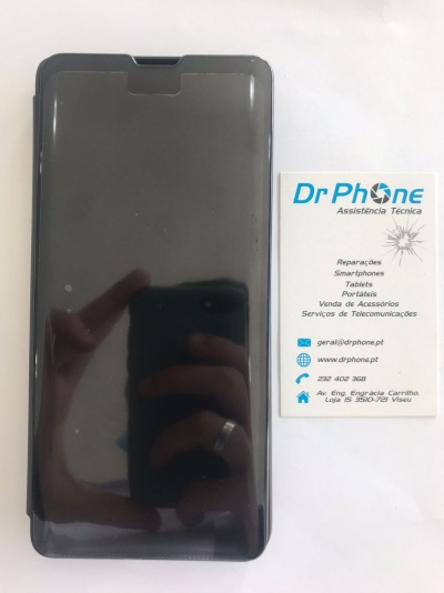 Smartphone preto junto a cartão de assistência técnica Dr Phone