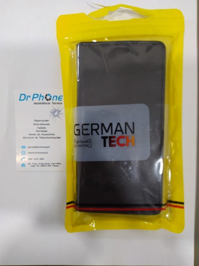 Telemóvel preto em embalagem plástica amarela com etiqueta GERMAN TECH