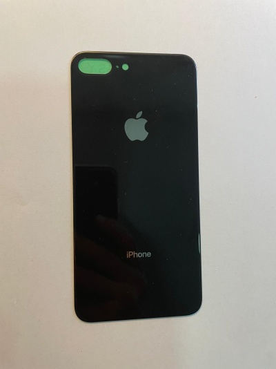 Smartphone Apple iPhone preto numa superfície branca