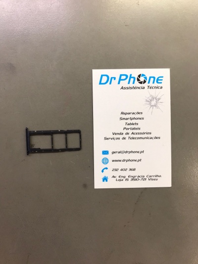 Suporte para cartões SIM preto ao lado de cartão de visita branco da Dr Phone