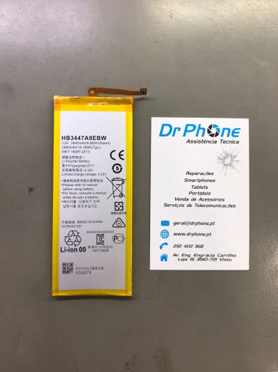 Bateria de telemóvel e cartão de visita Dr Phone sobre superfície cinza