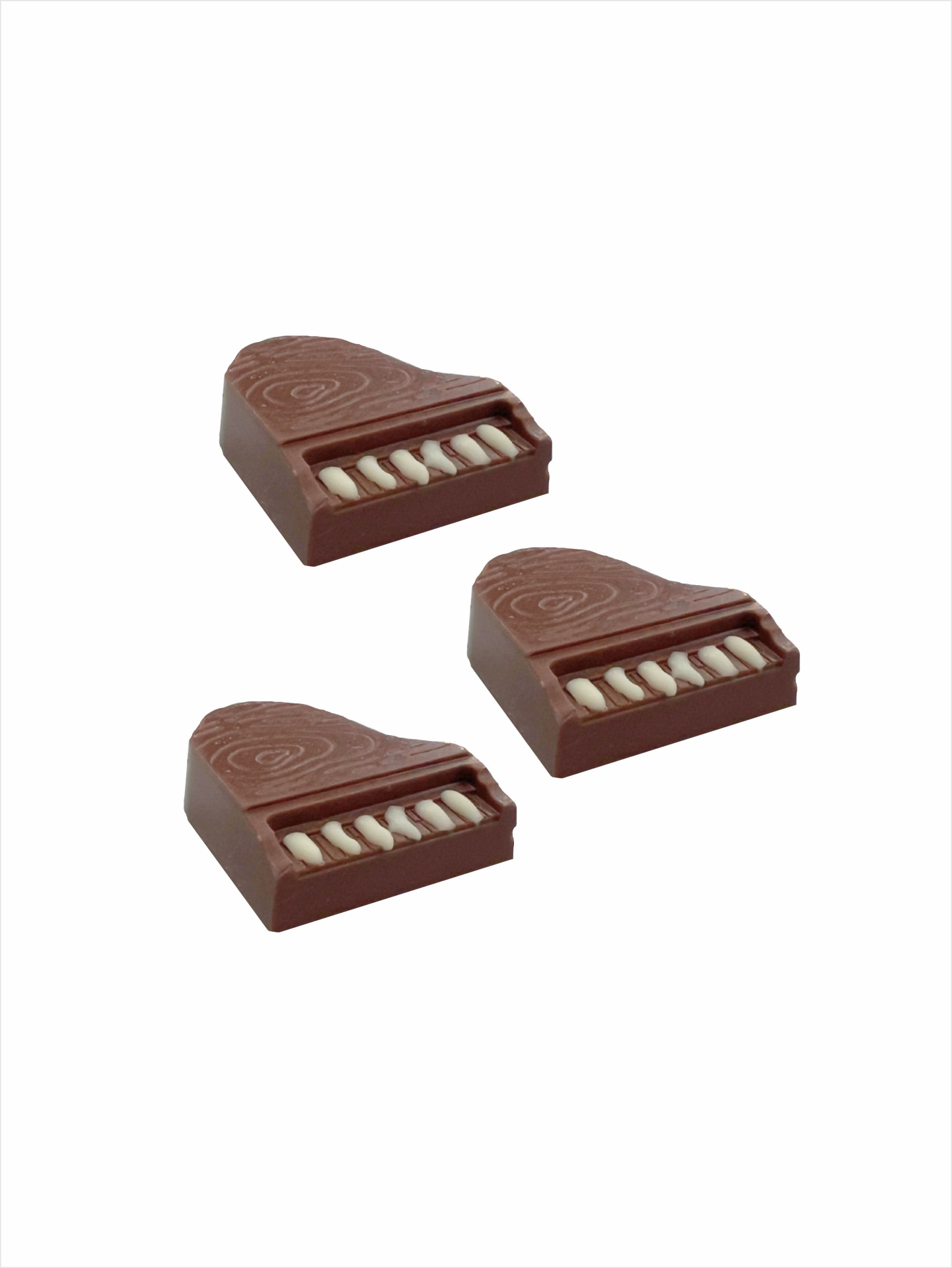 Pianos de chocolate 75g #Dammenberg sem glúten Três chocolates em forma de piano com detalhes em branco