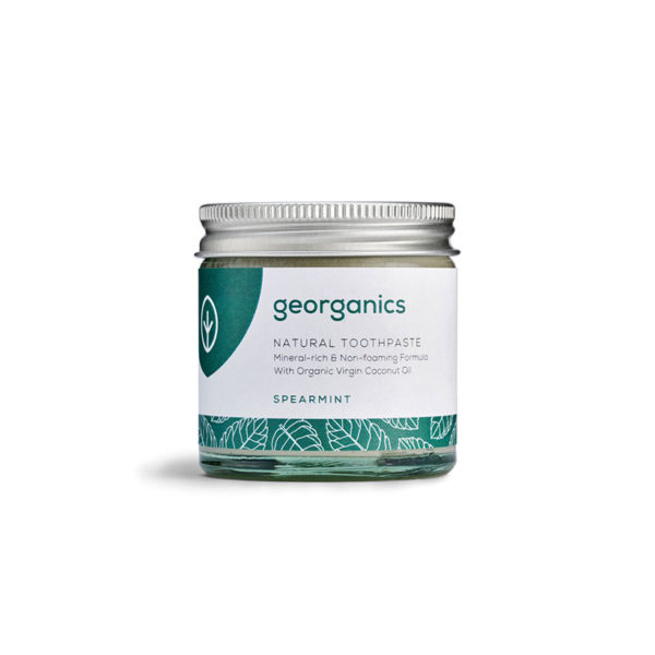 Frasco de pasta de dentes natural georganics com tampa metálica e rótulo branco e verde