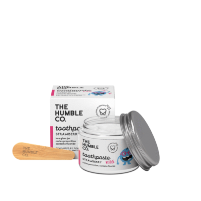 Pasta de dentes infantil em frasco de vidro com tampa prateada e colher de madeira