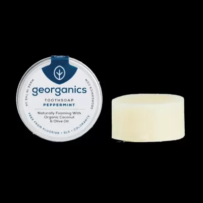 Sólido para limpeza dental georganics peppermint com embalagem redonda azul e branca