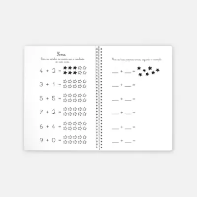 Livro infantil aberto com exercícios de matemática e estrelas desenhadas.