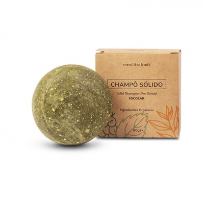 Champô sólido verde com embalagem castanha de papel com texto impresso