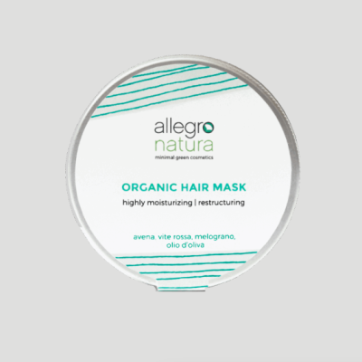 Frasco branco com tampa prateada e rótulo branco e verde de máscara capilar orgânica