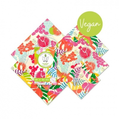 Guardanapos de papel coloridos com padrão de frutas e folhas e etiqueta VEGAN.