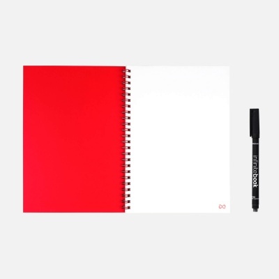 Caderno espiral vermelho aberto com caneta preta mindbook