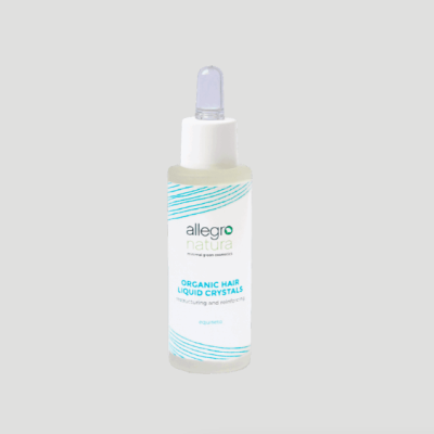 Frasco de vidro com conta-gotas branco de produto para cabelo com rótulo branco azul e verde