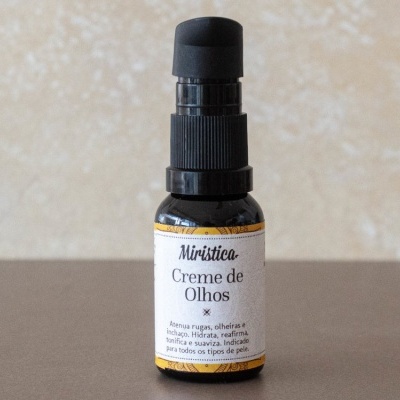 Frasco pequeno de vidro âmbar com creme de olhos e doseador preto