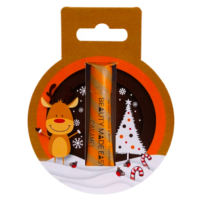 Batom labial Caramel Beauty Made Easy em embalagem natalícia com rena e árvore de Natal.