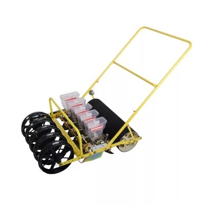 semeadora manual amarela metal com rodas pretas e cinza e contentores de plástico