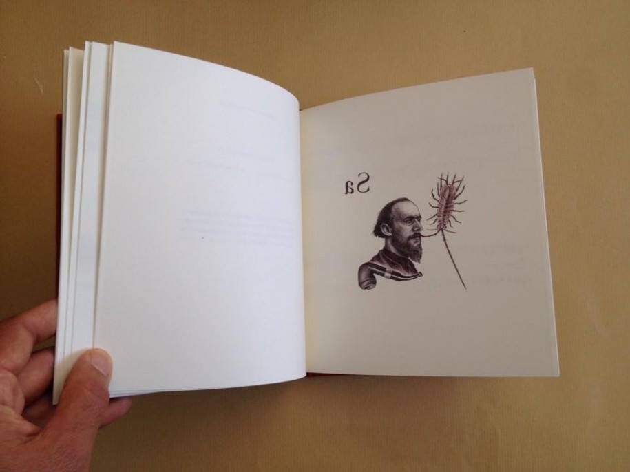 Bundle: EMBRYONS DESSÉCHÉS, ERIK SATIE + SATIE.150, JOANA GAMA Livro aberto com desenho de homem e inseto, texto 'Sa', fundo castanho