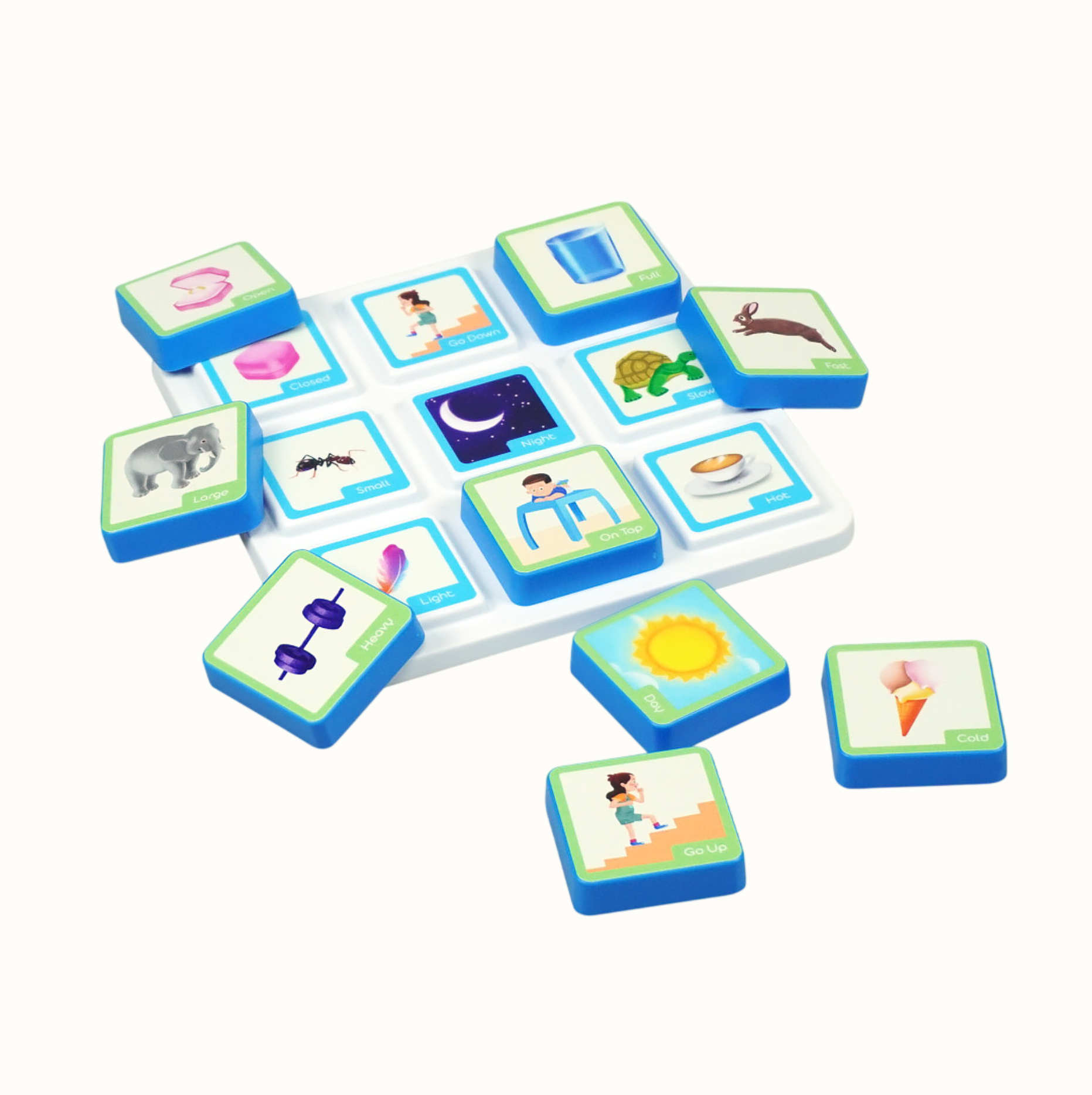 Childrens educational game set with blue tiles having images and words on a white board