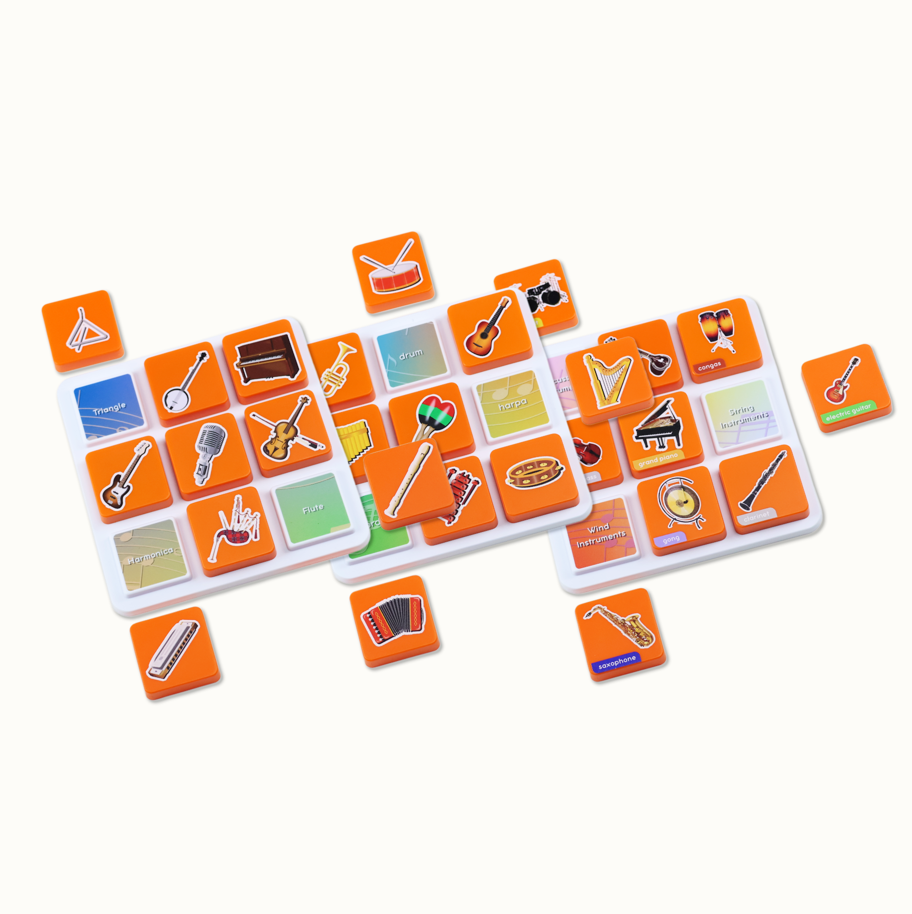 Orange game tiles with musical instrument illustrations and labels on white boards