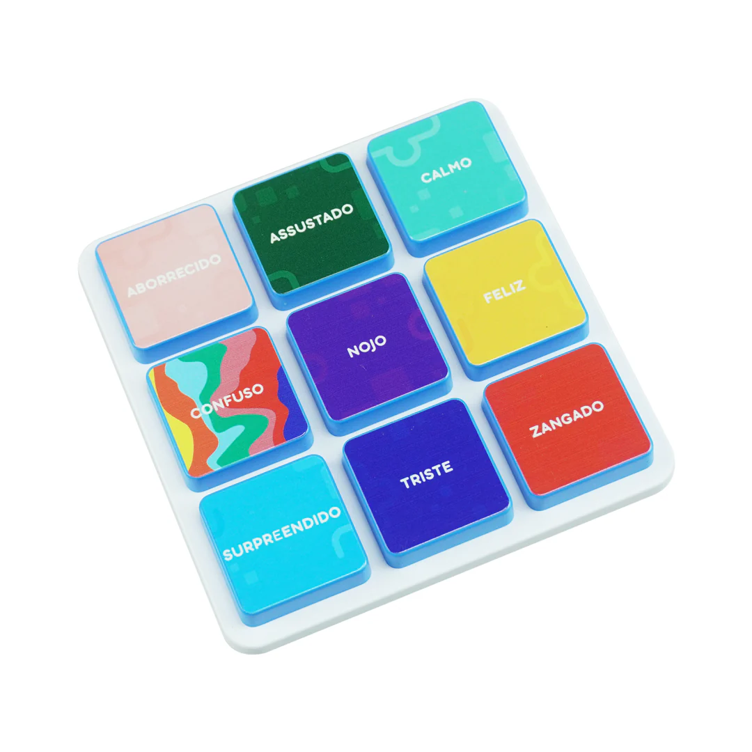 Colorful wooden blocks with Portuguese emotion words on a white board