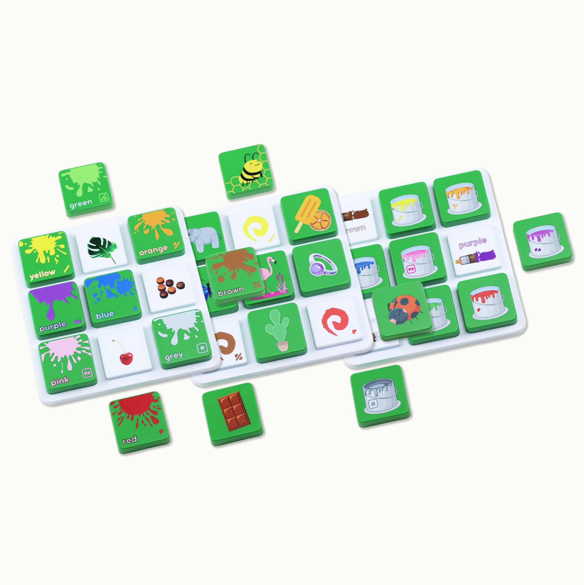 Green square tiles with colorful paint splashes and objects, color names like green, orange, brown, purple, red, yellow, pink on white trays