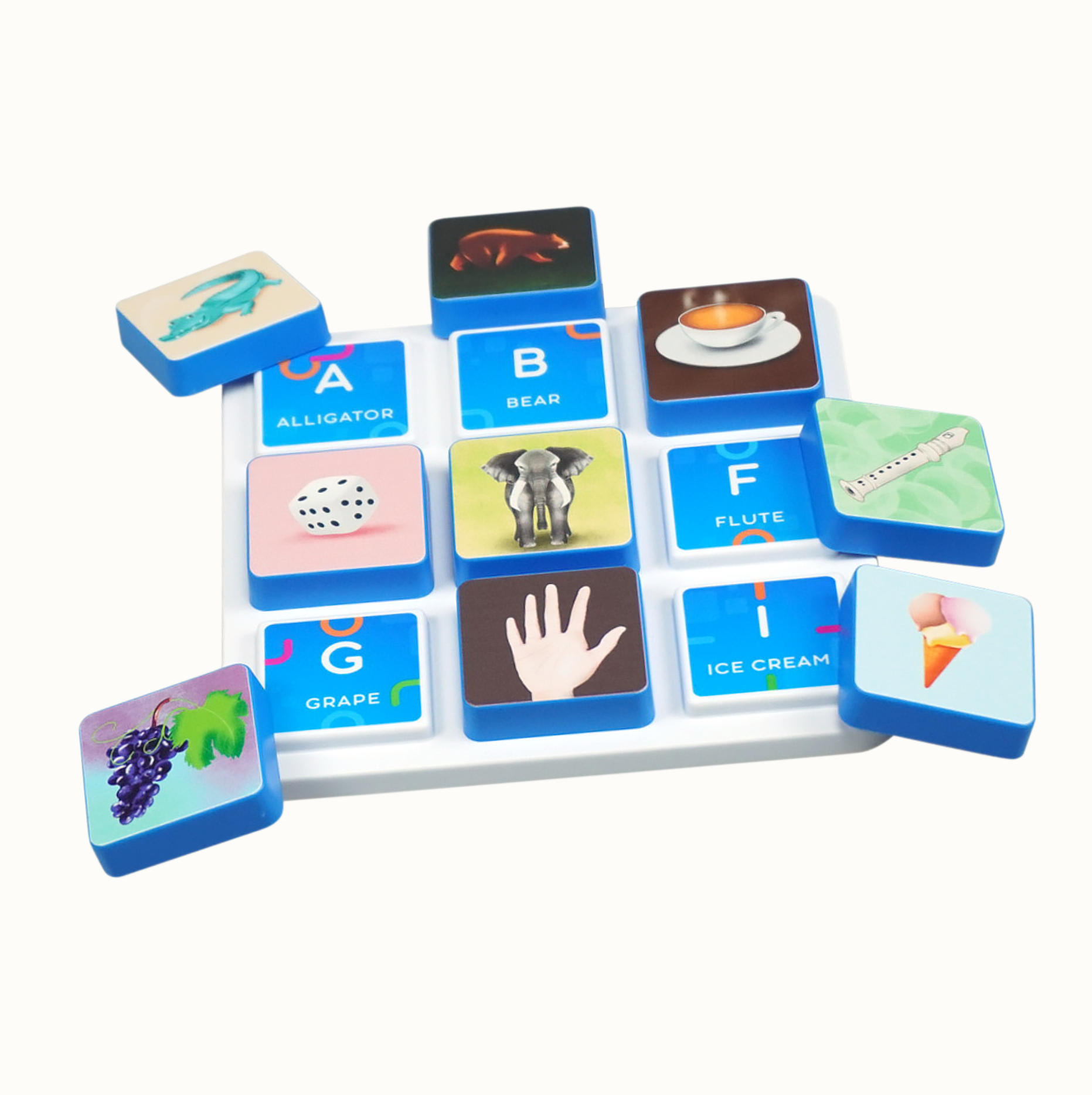 Blue educational blocks with pictures and text on a white tray