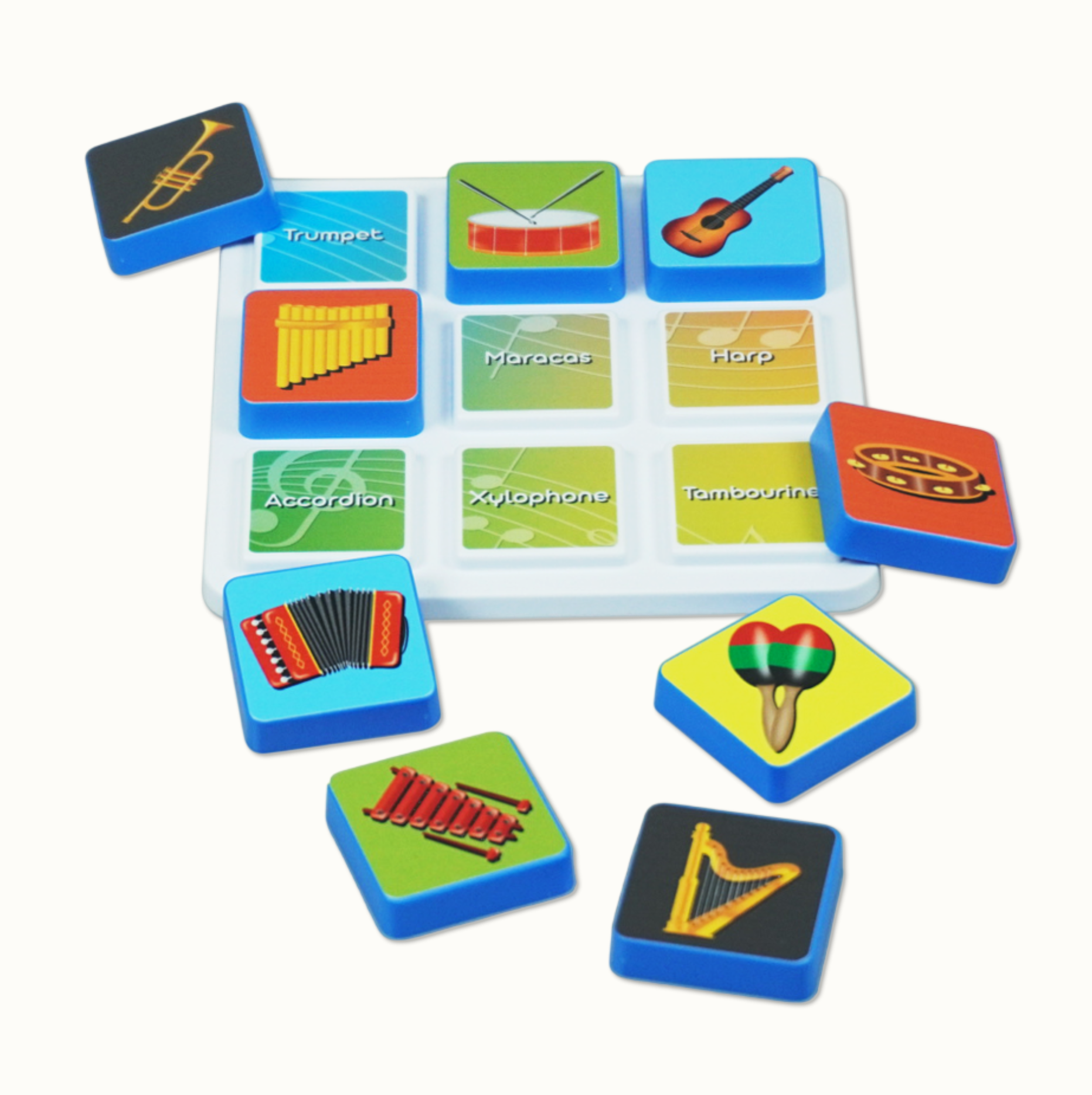 Childrens matching game with musical instrument tiles and names on a white board.