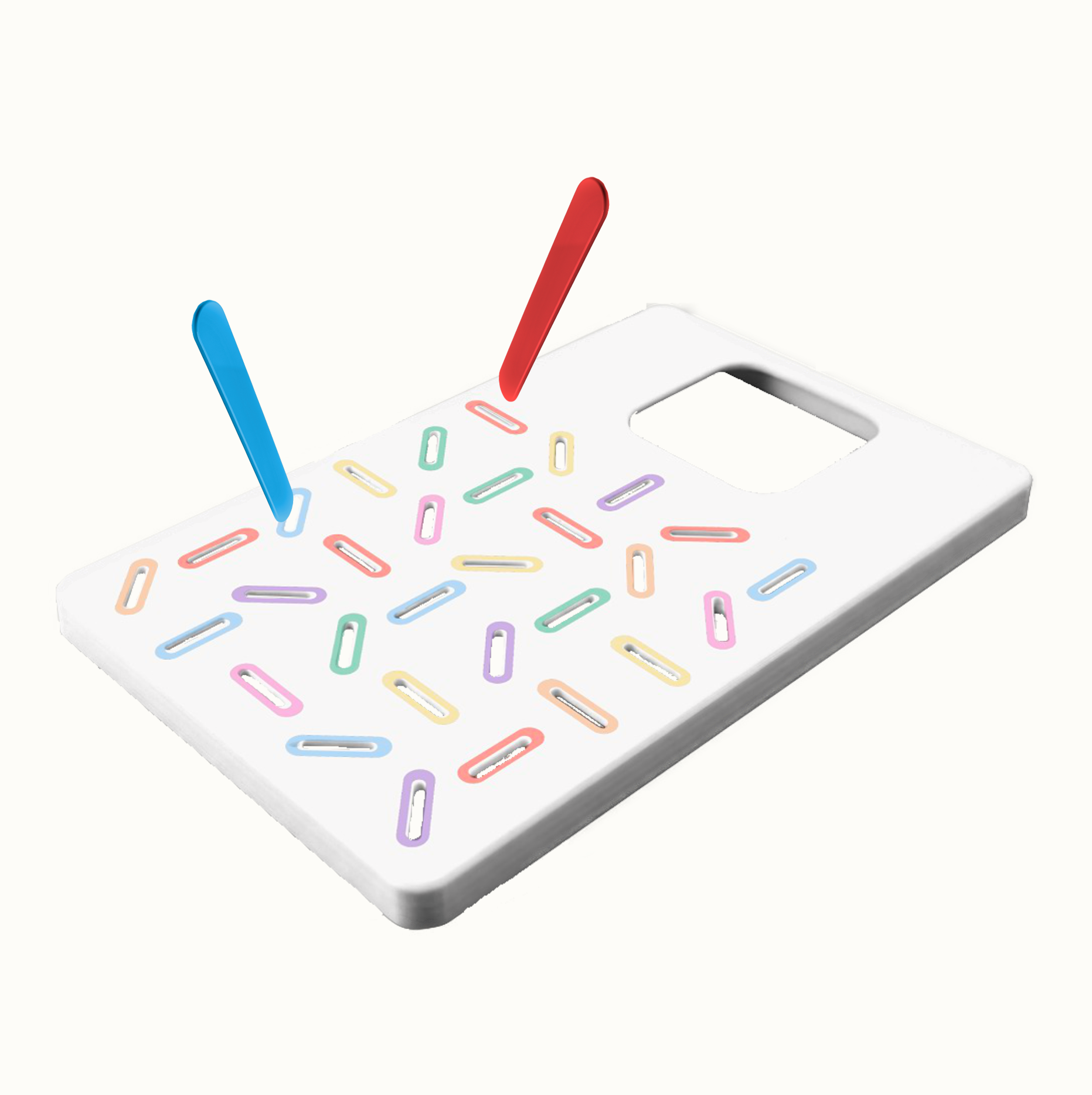 White rectangular plastic grater with colorful oval holes and red and blue peelers