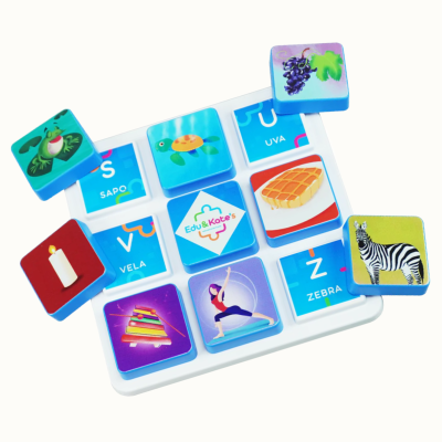 Childrens matching game tiles with animals, objects, and words on a white board