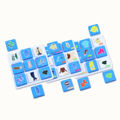 Educational blue blocks with clothing illustrations and labels on a white board