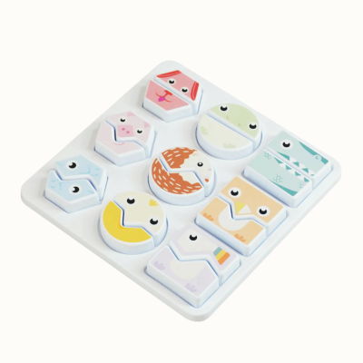 Childrens animal-shaped puzzle pieces in a white tray