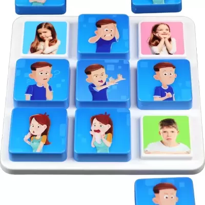 Tiles showing cartoon and real children facial expressions on blue, pink, and green backgrounds on a white base.
