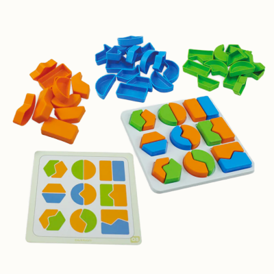 Colorful geometric puzzle pieces and instruction card on white background