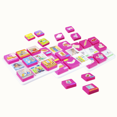 Educational tiles with pink edges and images of household items and rooms labeled in Portuguese on white trays.