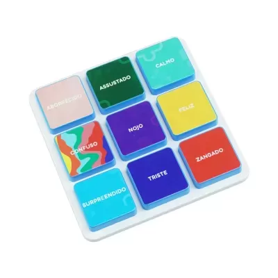 Colorful wooden blocks with Portuguese emotion words on a white board