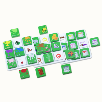 Green square tiles with colorful paint splashes and objects, color names like green, orange, brown, purple, red, yellow, pink on white trays