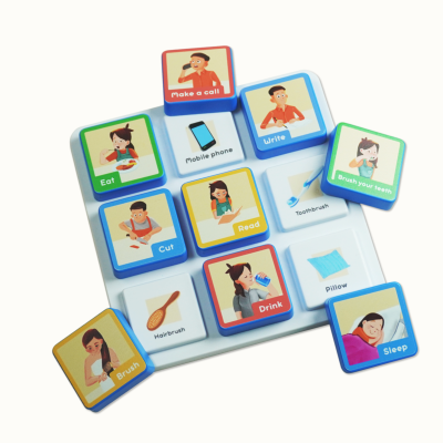 Colorful educational tiles with cartoon images and words on a white base