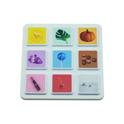 White board with nine colorful image tiles including fruit, flower, leaf, candy, lipstick, and spoons