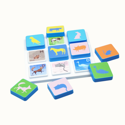 Animal silhouette tiles on a white board with labels