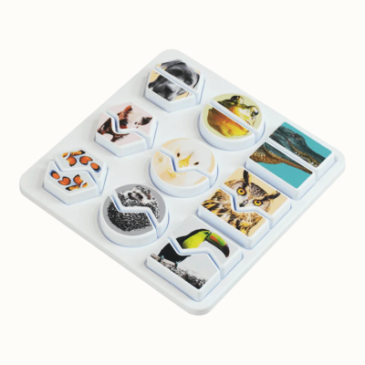 Animal picture puzzle pieces on white tray