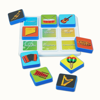 Childrens matching game with musical instrument tiles and names on a white board.
