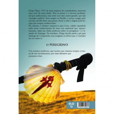 Parte de trás de um livro com concha de vieira amarela e campo de trigo ao fundo