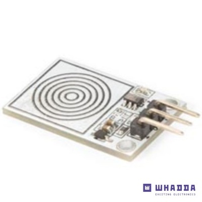 Placa eletrónica branca com três pinos dourados e padrão de anéis concêntricos